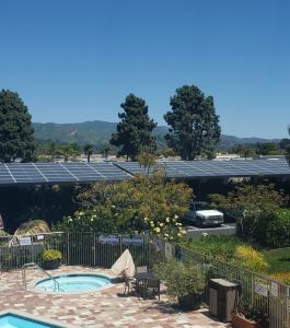 Solar power aray as seen over the parking lot past the pool