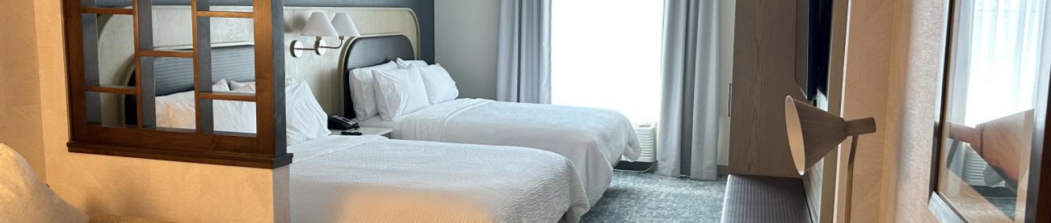 Photo of a newly remodeled Queen-Queen mini-suite with sleeper sofa