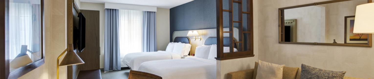 Standard Two Queen Bed Guestroom with sofa sleeper