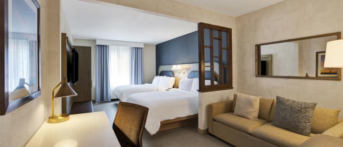 Standard Two Queen Bed Guestroom with sofa sleeper